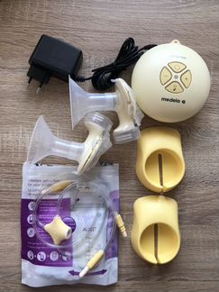 Молокоотсос Medela swing maxi